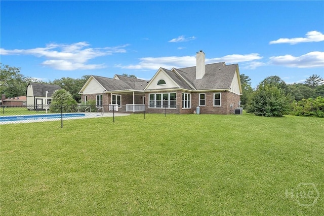 600 Old Louisville Rd, Guyton, GA 31312 - back of house featuring brick siding and a chimney