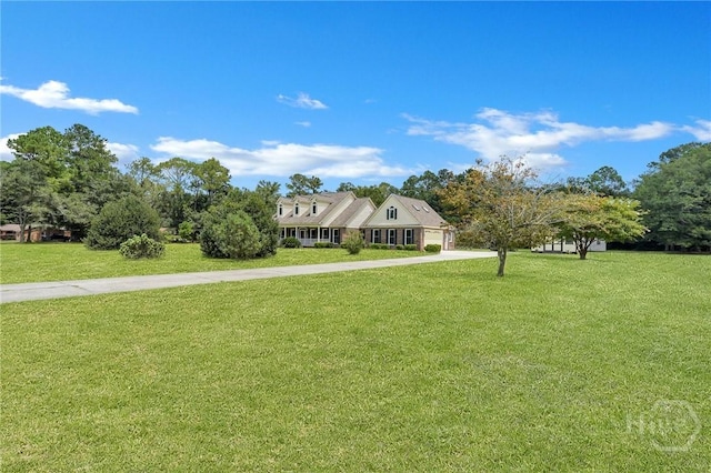 600 Old Louisville Rd, Guyton, GA 31312 - view of front facade featuring concrete driveway, a garage, and a front yard