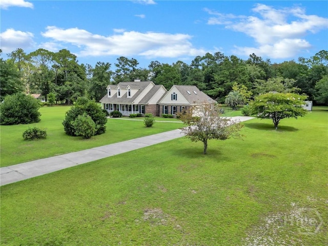 600 Old Louisville Rd, Guyton, GA 31312 - cape cod house with a front yard, driveway, and a chimney
