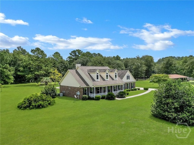 600 Old Louisville Rd, Guyton, GA 31312 - cape cod home featuring a front lawn and a chimney