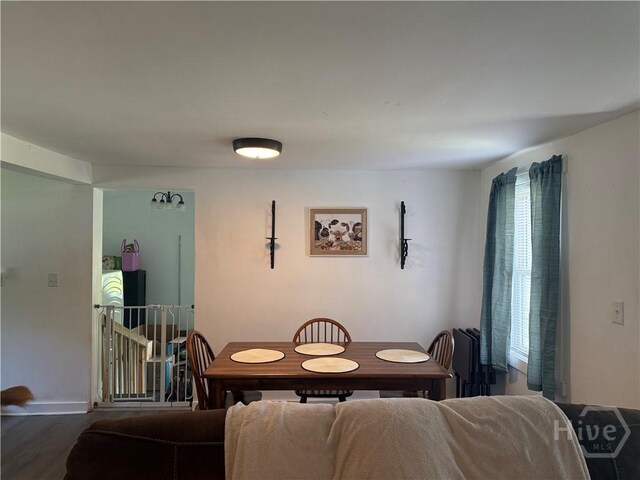 3052 Effingham Hwy, Sylvania, GA 30467 - dining area with radiator and wood finished floors