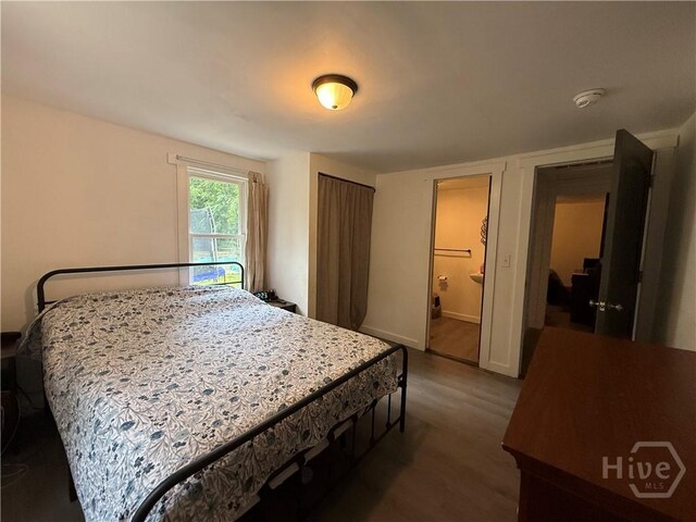 3052 Effingham Hwy, Sylvania, GA 30467 - bedroom featuring dark wood-style floors and baseboards