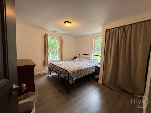 3052 Effingham Hwy, Sylvania, GA 30467 - bedroom featuring dark wood-style flooring and baseboards