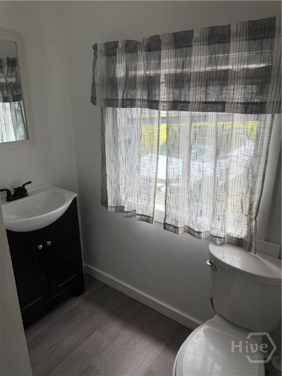 3052 Effingham Hwy, Sylvania, GA 30467 - bathroom with vanity and wood finished floors