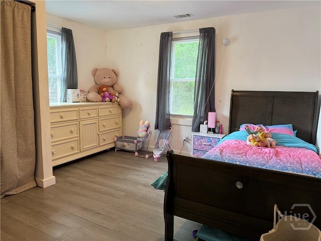 3052 Effingham Hwy, Sylvania, GA 30467 - bedroom with multiple windows and wood finished floors
