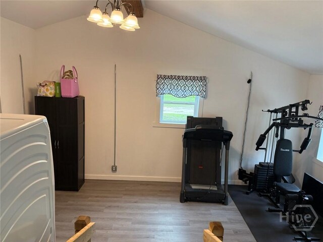 3052 Effingham Hwy, Sylvania, GA 30467 - workout area featuring vaulted ceiling, light wood finished floors, and washer / dryer