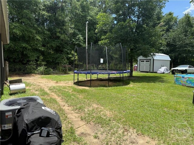 3052 Effingham Hwy, Sylvania, GA 30467 - view of yard featuring a storage shed and a trampoline