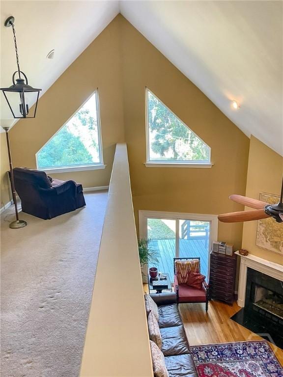 606 Dancy Ave, Savannah, GA 31419 - living room featuring lofted ceiling, healthy amount of natural light, and a fireplace with flush hearth