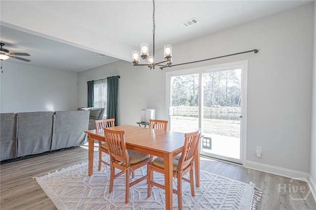194 Gavin Way, Rincon, GA 31326 - dining space featuring a chandelier, light wood-style flooring, and ceiling fan