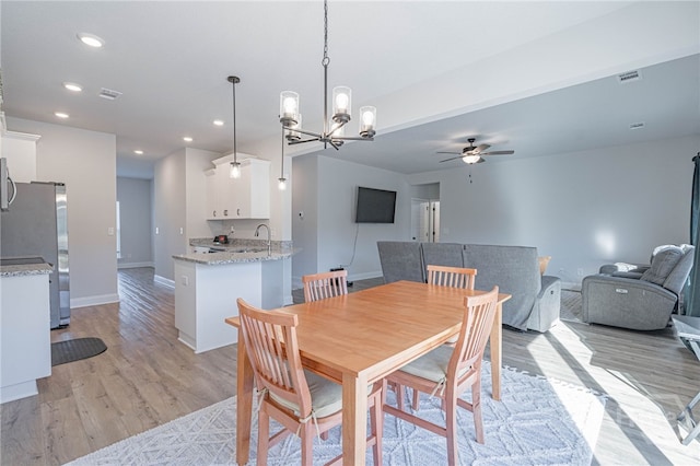 194 Gavin Way, Rincon, GA 31326 - dining space featuring ceiling fan, light wood finished floors, a chandelier, and recessed lighting