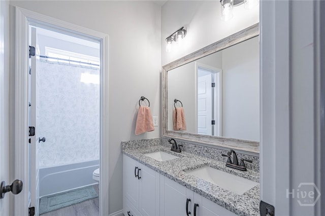 194 Gavin Way, Rincon, GA 31326 - full bathroom featuring double vanity,  shower combination, and wood finished floors