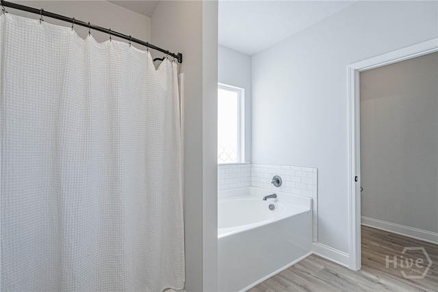 194 Gavin Way, Rincon, GA 31326 - full bathroom with wood finished floors, a bath, and curtained shower