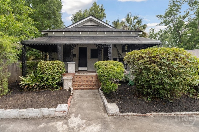 1025 W 40th St, Savannah, GA 31415 - view of front of property featuring a porch and a shingled roof