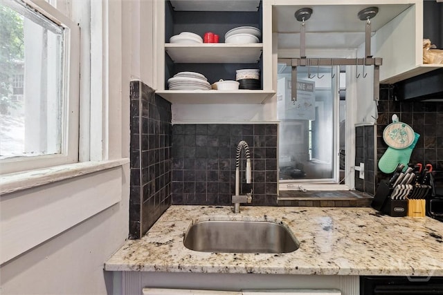 1025 W 40th St, Savannah, GA 31415 - kitchen featuring tasteful backsplash, light stone countertops, and open shelves