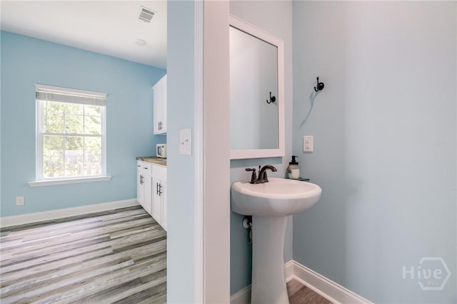 118 Plantation Way, Guyton, GA 31312 - bathroom with wood finished floors and baseboards