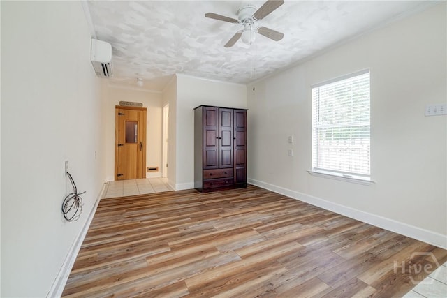 118 Plantation Way, Guyton, GA 31312 - unfurnished bedroom with a wall mounted air conditioner, light wood-style flooring, crown molding, and a ceiling fan