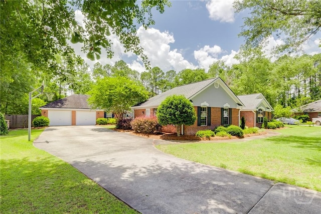 118 Plantation Way, Guyton, GA 31312 - ranch-style house featuring brick siding, a garage, and an outdoor structure