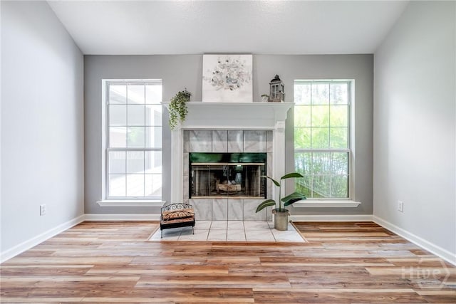 118 Plantation Way, Guyton, GA 31312 - living room featuring wood finished floors and a tile fireplace
