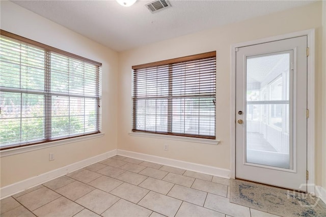 118 Plantation Way, Guyton, GA 31312 - doorway to outside with light tile patterned floors and baseboards
