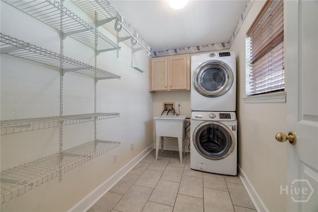 118 Plantation Way, Guyton, GA 31312 - washroom with cabinet space, stacked washer / drying machine, and light tile patterned floors
