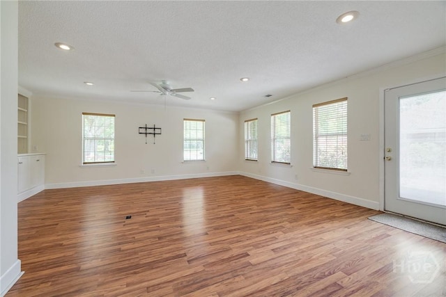118 Plantation Way, Guyton, GA 31312 - unfurnished living room featuring plenty of natural light, wood finished floors, ceiling fan, crown molding, and recessed lighting