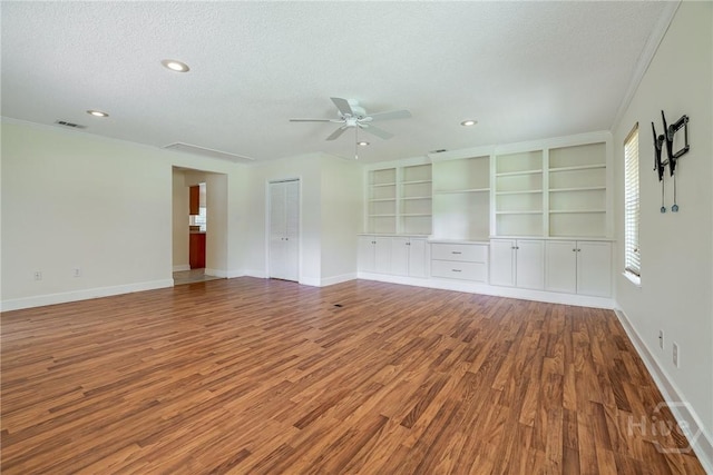 118 Plantation Way, Guyton, GA 31312 - unfurnished room with a textured ceiling, wood finished floors, a ceiling fan, recessed lighting, and crown molding