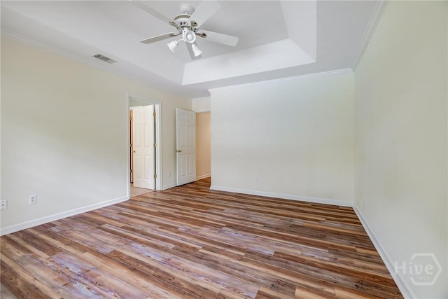 118 Plantation Way, Guyton, GA 31312 - spare room with wood finished floors, ornamental molding, a raised ceiling, and a ceiling fan