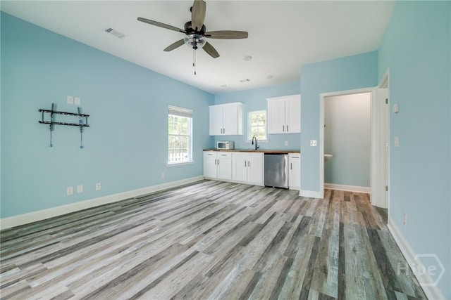 118 Plantation Way, Guyton, GA 31312 - kitchen featuring dishwasher, light wood-style flooring, white cabinetry, a ceiling fan, and open floor plan