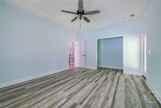 118 Plantation Way, Guyton, GA 31312 - empty room with a ceiling fan and wood finished floors