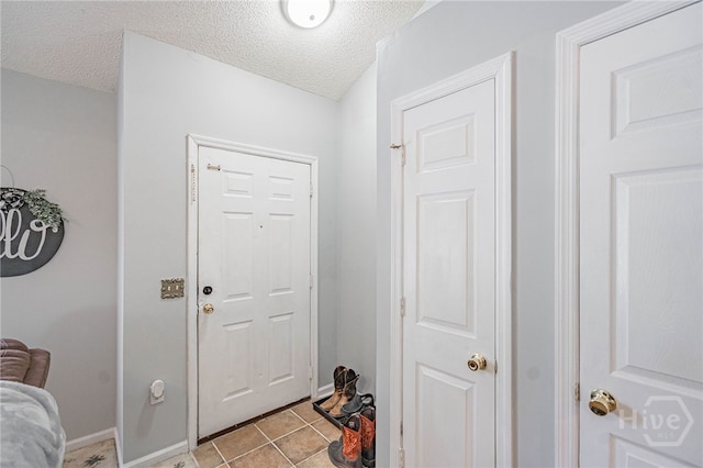 203 Deer Rd, Springfield, GA 31329 - foyer entrance featuring a textured ceiling and light tile patterned floors