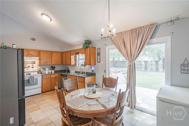 203 Deer Rd, Springfield, GA 31329 - dining area with lofted ceiling, a chandelier, light tile patterned floors, and a textured ceiling