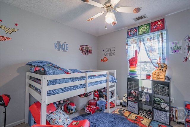 203 Deer Rd, Springfield, GA 31329 - bedroom featuring a textured ceiling, ceiling fan, and carpet flooring