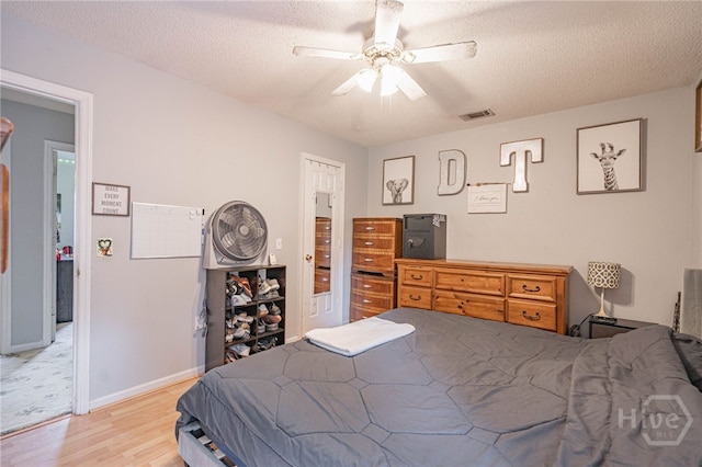 203 Deer Rd, Springfield, GA 31329 - bedroom featuring wood finished floors, a textured ceiling, and ceiling fan