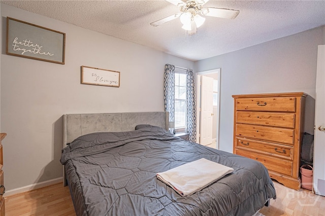 203 Deer Rd, Springfield, GA 31329 - bedroom featuring wood finished floors, a textured ceiling, and ceiling fan