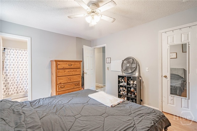 203 Deer Rd, Springfield, GA 31329 - bedroom featuring light wood finished floors, a textured ceiling, and ceiling fan