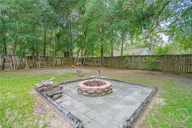 203 Deer Rd, Springfield, GA 31329 - fenced backyard featuring an outdoor fire pit and a patio