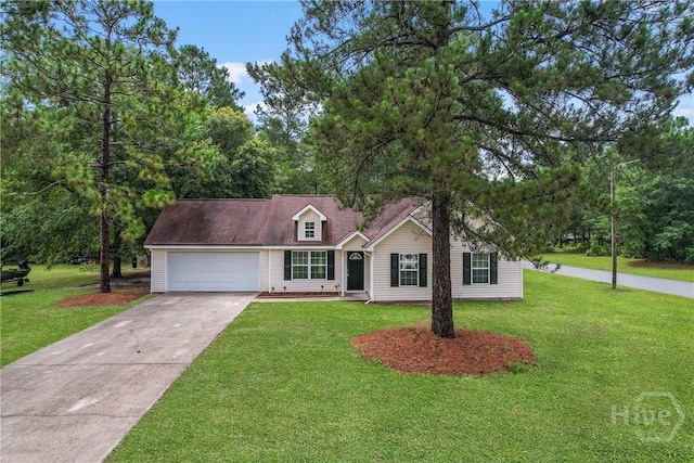 99 Dailey Dr, Guyton, GA 31312 - view of front of home featuring a garage, driveway, and a front yard