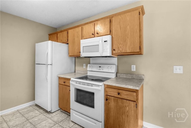 99 Dailey Dr, Guyton, GA 31312 - kitchen featuring white appliances and light countertops