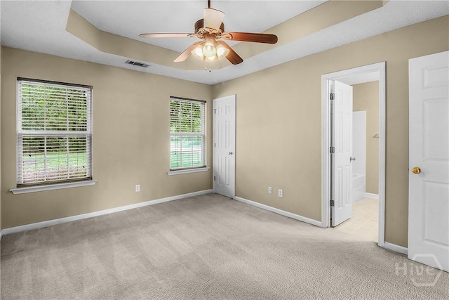 99 Dailey Dr, Guyton, GA 31312 - unfurnished bedroom with carpet, ensuite bathroom, ceiling fan, and a closet