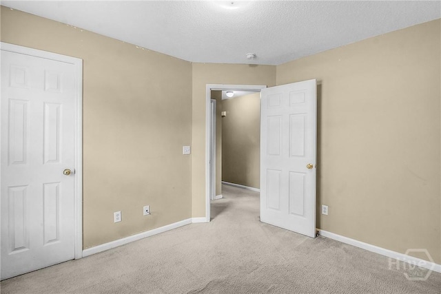 99 Dailey Dr, Guyton, GA 31312 - unfurnished bedroom featuring carpet floors and a textured ceiling