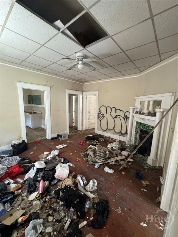 601 W 45th St, Savannah, GA 31405 - spare room with a paneled ceiling, crown molding, a fireplace, and ceiling fan
