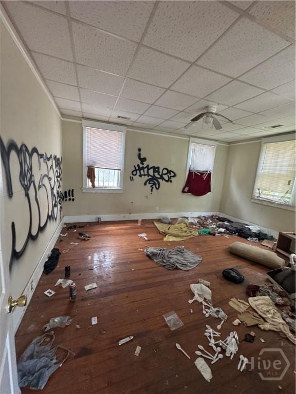 601 W 45th St, Savannah, GA 31405 - unfurnished living room featuring ornamental molding, hardwood / wood-style flooring, ceiling fan, and a paneled ceiling