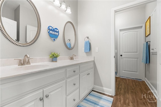 2016 Pippin Pl, Statesboro, GA 30461 - bathroom featuring double vanity and wood finished floors