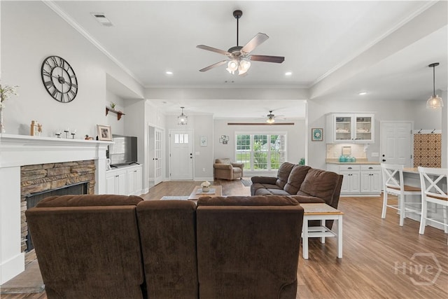 2016 Pippin Pl, Statesboro, GA 30461 - living room featuring crown molding, ceiling fan, light wood-style floors, recessed lighting, and a fireplace