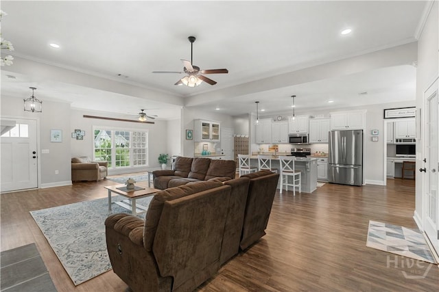 2016 Pippin Pl, Statesboro, GA 30461 - living area with crown molding, dark wood-style floors, recessed lighting, and a ceiling fan