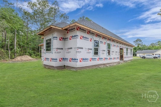 163 Sea Island Rd, Midway, GA 31320 - view of side of home with a lawn and roof with shingles