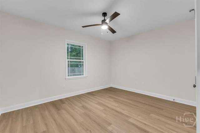 163 Sea Island Rd, Midway, GA 31320 - empty room featuring light wood finished floors and a ceiling fan