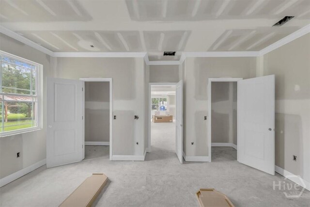 135 Houston St, Pooler, GA 31322 - unfurnished bedroom featuring a spacious closet, multiple windows, ornamental molding, and carpet flooring