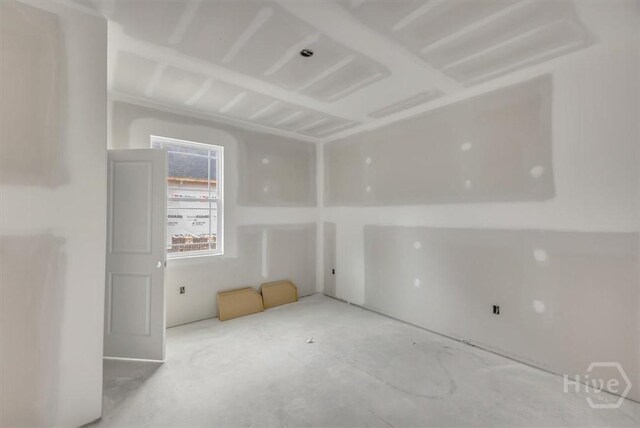 135 Houston St, Pooler, GA 31322 - spare room featuring concrete flooring