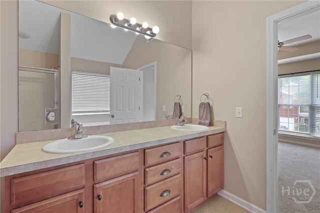 98 Peregrine Cir, Richmond Hill, GA 31324 - full bath with double vanity, ceiling fan, an enclosed shower, and tile patterned flooring